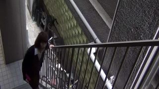 Brunette urinating public stairwell