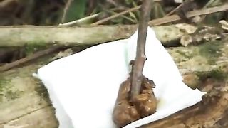 Girl with a car pooping in the woods