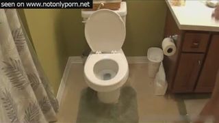 Blonde shitting in toilet