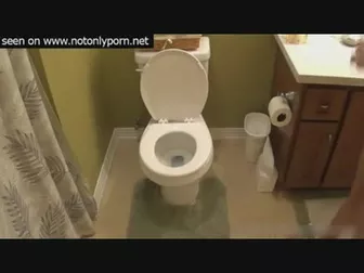 Blonde shitting in toilet