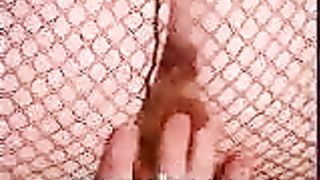 Middle aged pooping in her fishnet