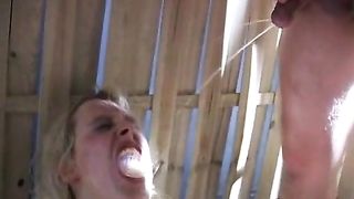 Two guys peeing in a blonde girls mouth