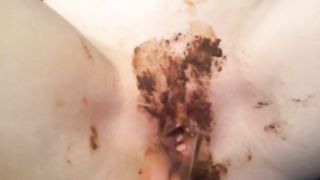 Finger fucking her shit covered pussy
