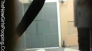 Sexy curvy babe shitting over toilet
