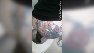 Tattooed babe pooping in toilet