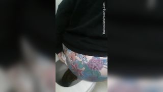 Tattooed babe pooping in toilet