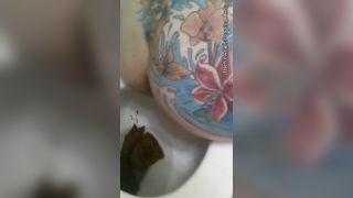 Tattooed babe pooping in toilet