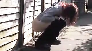 Teen redhead caught peeing in public