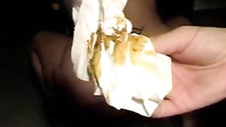 Two girls pooping in a card box slowly