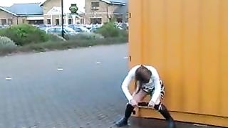 Peeing behind a metallic container