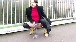 Peeing on a concrete bridge
