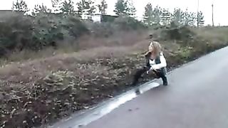 Sexy babe peeing on the highway