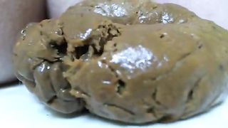 Blonde babe shitting in close up slowly