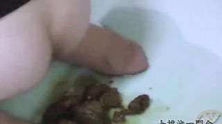 Asian teen shitting between legs