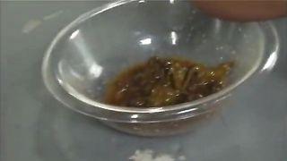 Asian teen shitting in a glass bowl