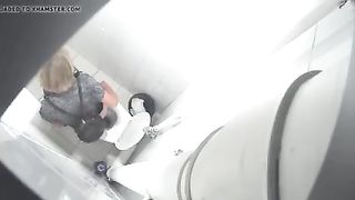 Spying on a blonde milf shitting