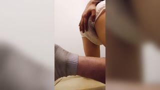 He's pooping in white diapers