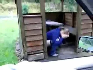 Shitting in a wooden outdoor house