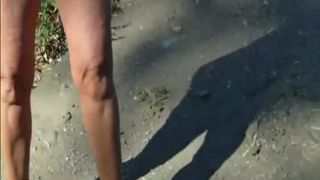 Tanned milf pooping outdoor