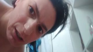 Brunette milf smears shiot on her face