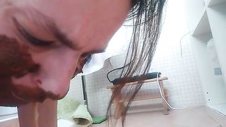 Brunette milf smears shiot on her face