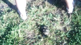 Smearing shit on her face in public place