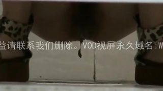 Shaved girl shitting over toilet