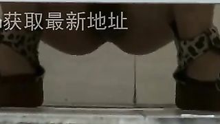 Shaved girl shitting over toilet