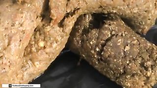 Hairy girl pooping on a white plate