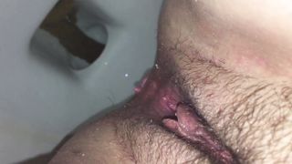 Brown shit dropped over toilet