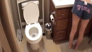 Petite girl shits over toilet