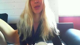 Blonde beauty pooping in a cup