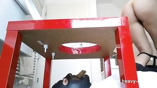 Shitting on masked slave