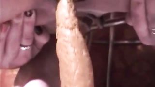 Close up of a brunette babe shitting