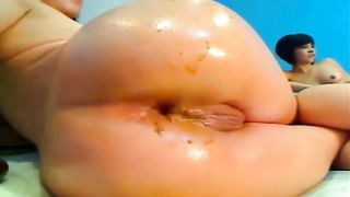 Fisting her tight butthole hard