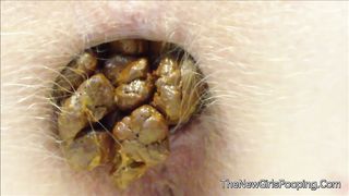 Close up of hairy babe shitting