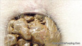 Close up of hairy babe shitting