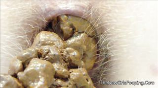 Close up of hairy babe shitting