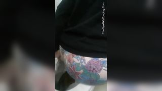 Tattooed babe shitting