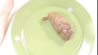 Big brown turd on green plate