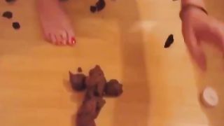 Cute brunette masturbates with shit