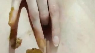 Close up of sweet babe shitting