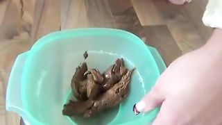 Brunette babe masturbates with crap