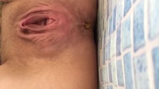 Shaved teen shitting