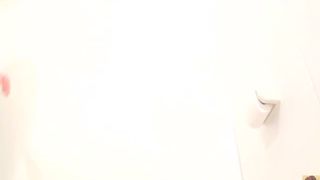 Young jap girl using public bathroom