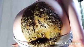 Dark haired babe smears poop hard