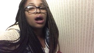 Black girl using a public bathroom