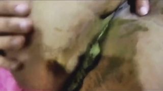 Black babe pooping in close up