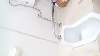Brown haired babe caught shitting