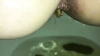 Hairy milf pushing big turd